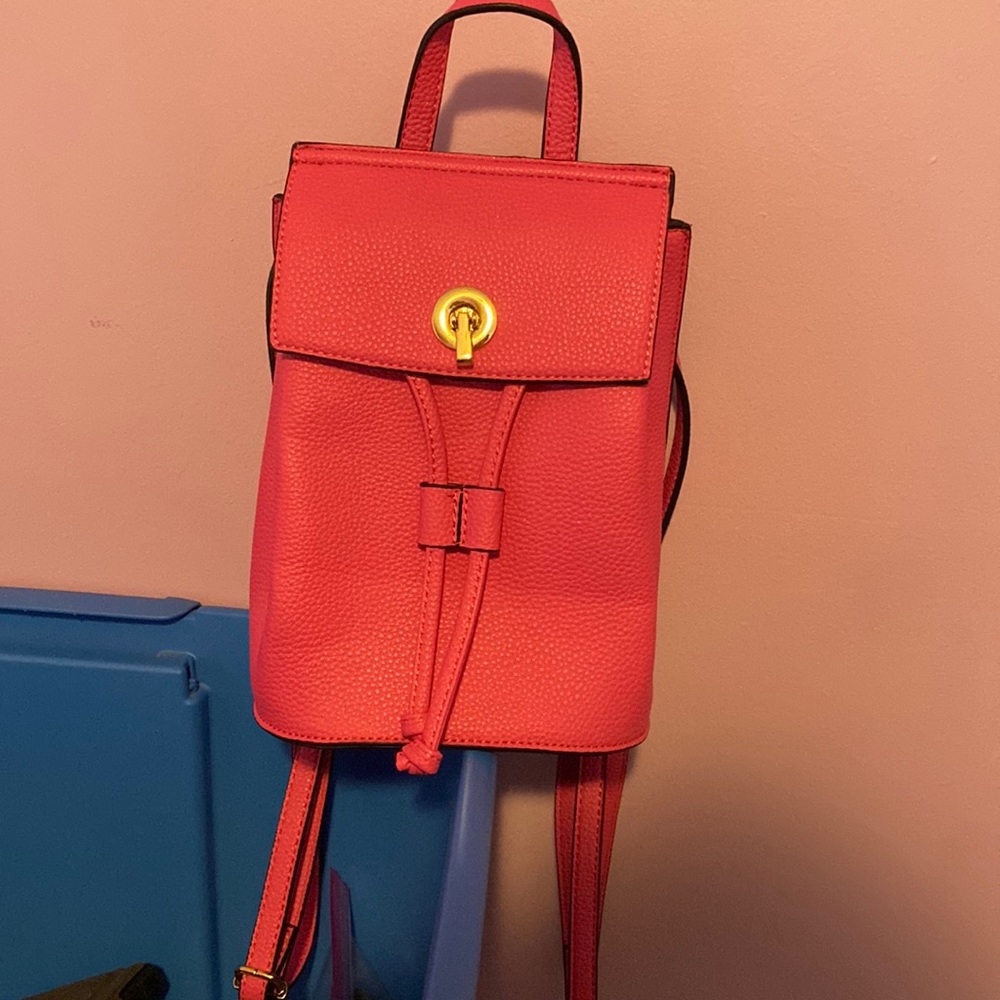 Boutique Style handbag. Hot Pink with gold front closure.